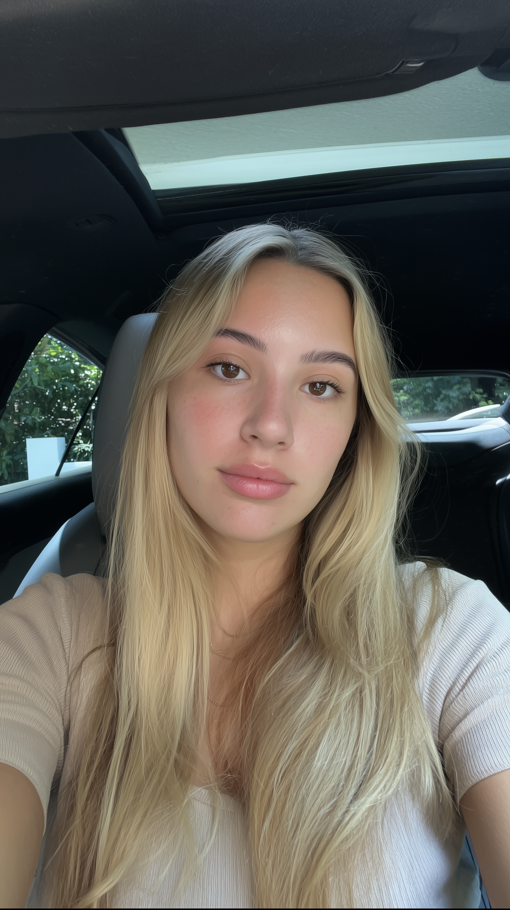 files/booboo567_A_natural_car_selfie_of_a_beautiful_young_woman_with__89717b87-e1fe-4723-811b-b5b6ebeeb7d9.png